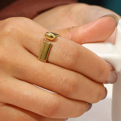 Gold ring on a finger with a blurred background